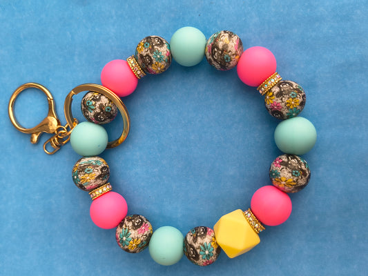 Multi Color Flowers, Light Blue and Pink Wristlet